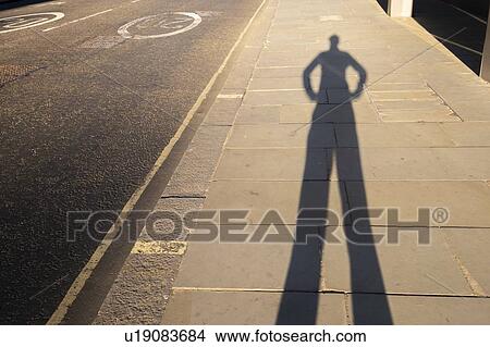 Picture - Shadow with hands on hips. Fotosearch