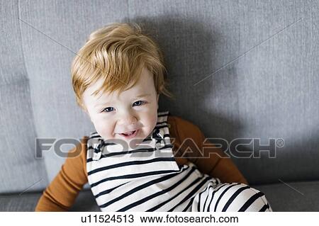 Smiling baby boy on sofa View Large Photo Image Stock Image - Smiling baby boy on sofa. Fotosearch