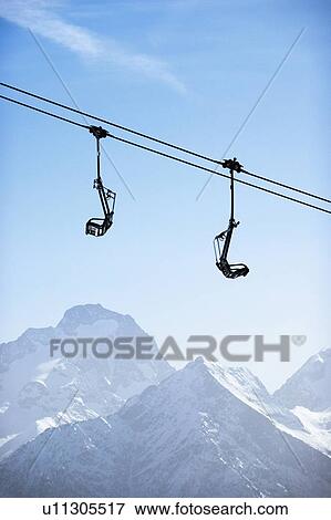 Stock Photo - Snow covered mountain landscape with ski lift, Alpe-d'Huez, Rhone-Alpes, France. Fotosearch