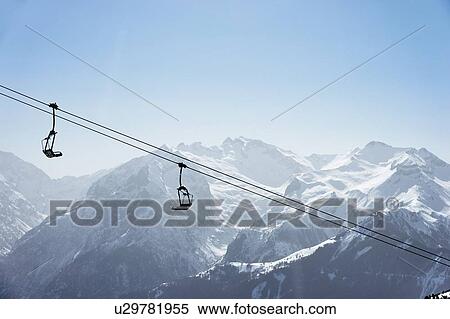 Stock Photography - Snow covered mountain landscape with ski lift, Alpe-d'Huez, Rhone-Alpes, France. Fotosearch