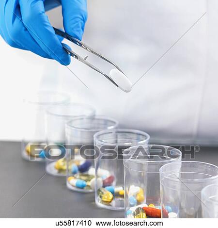 Stock Image - Sorting medications. Fotosearch