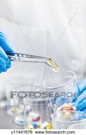 Stock Photograph - Sorting medications. Fotosearch