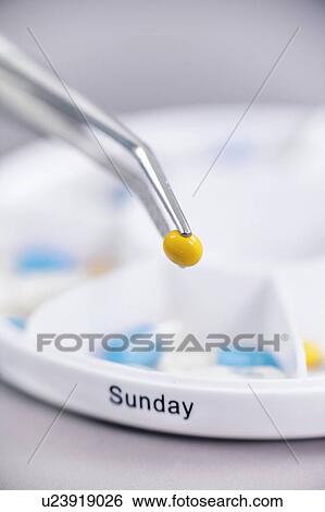 Stock Photograph - Sorting medications. Fotosearch