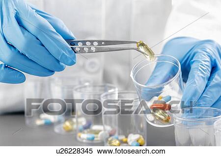 Stock Photography - Sorting medications. Fotosearch