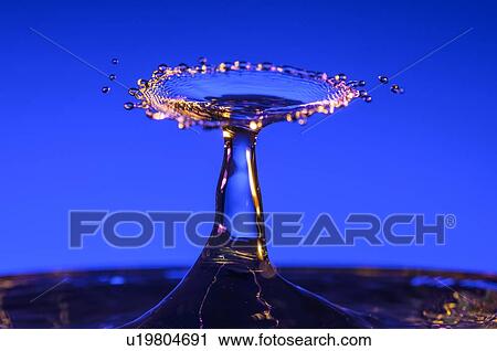 Splashing water against blue background View Large Photo Image Stock Image - Splashing water against blue background. Fotosearch