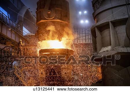 Steelworkers starting pour of molten steel in steelworks View Large Photo Image Stock Image - Steelworkers starting pour of molten steel in steelworks. Fotosearch