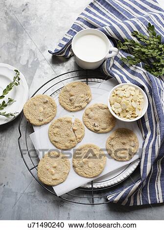Stock Image - Still life of almond cookies on cooling rack, overhead view. Fotosearch