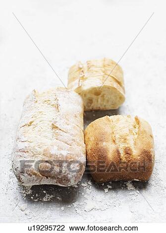Still life of floured and unfloured ciabatta loaf on baking tray, overhead view View Large Photo Image Stock Image - Still life of floured and unfloured ciabatta loaf on baking tray, overhead view. Fotosearch