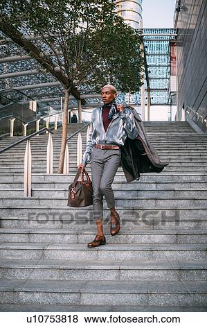 Stylish man going down stairs, Milan, Italy View Large Photo Image Stock Photo - Stylish man going down stairs, Milan, Italy. Fotosearch