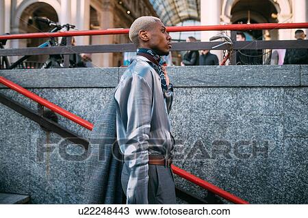 Stock Image - Stylish man going into subway station, Milan, Italy. Fotosearch