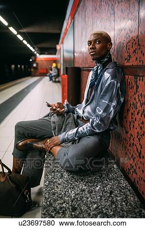 Stylish man on subway platform, Milan, Italy View Large Photo Image Stock Image - Stylish man on subway platform, Milan, Italy. Fotosearch