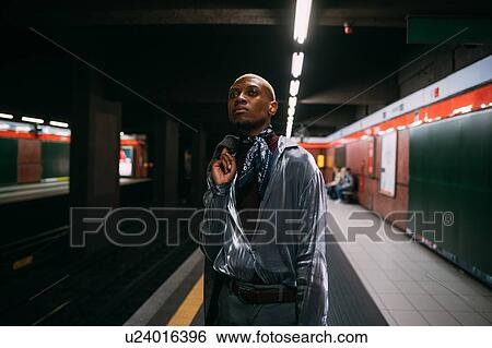 Stylish man on subway platform, Milan, Italy View Large Photo Image Stock Photograph - Stylish man on subway platform, Milan, Italy. Fotosearch