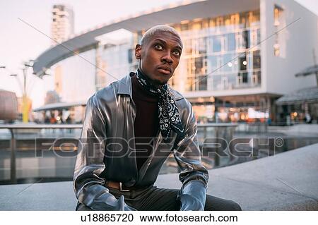 Stylish man sitting by water feature, Milan, Italy View Large Photo Image Stock Image - Stylish man sitting by water feature, Milan, Italy. Fotosearch
