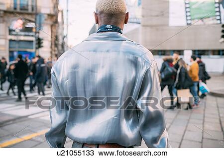 Stock Image - Stylish man walking in street, Milan, Italy. Fotosearch