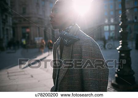 Stylish man walking in street, Milan, Italy View Large Photo Image Stock Image - Stylish man walking in street, Milan, Italy. Fotosearch