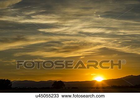 Stock Image - Sunset cloudscape in Picabo, Idaho, USA. Fotosearch