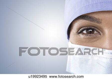 Surgeon wearing mask and cap View Large Photo Image Stock Photography - Surgeon wearing mask and cap. Fotosearch