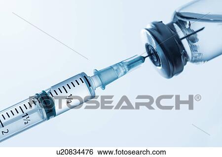 Stock Photograph - Syringe being filled. Fotosearch