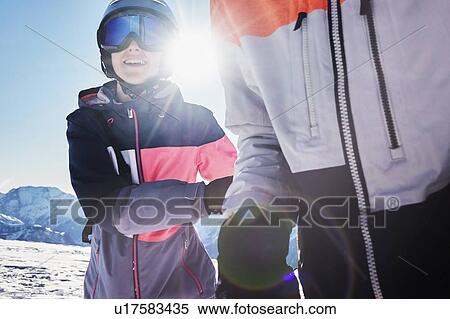 Teenage brother and sister skiers on snow covered mountain top, close up, Alpe-d'Huez, Rhone-Alpes, France View Large Photo Image Stock Photography - Teenage brother and sister skiers on snow covered mountain top, close up, Alpe-d'Huez, Rhone-Alpes, France. Fotosearch