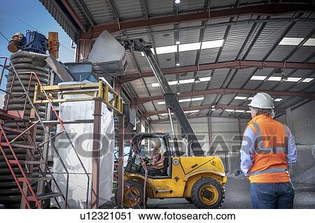 Titanium scrap being tipped into sorting machine in titanium recycling plant View Large Photo Image Stock Image - Titanium scrap being tipped into sorting machine in titanium recycling plant. Fotosearch