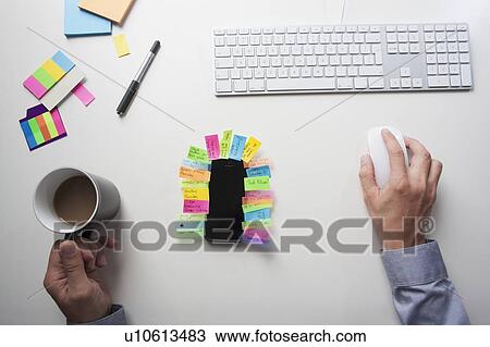 Stock Image - Top view of a desk. Fotosearch