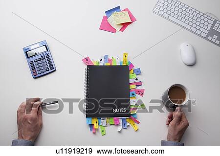 Stock Photo - Top view of a desk. Fotosearch