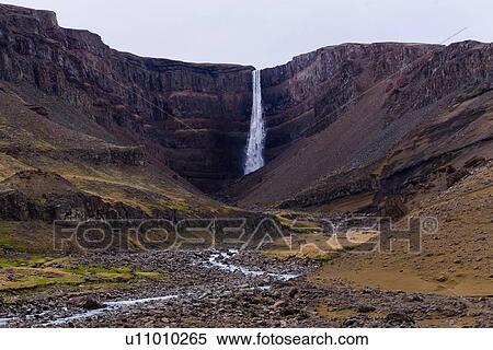 Stock Photography - Valley landscape with distant waterfall and stream, Hofn, Austur-Skaftafellssysla, Iceland. Fotosearch