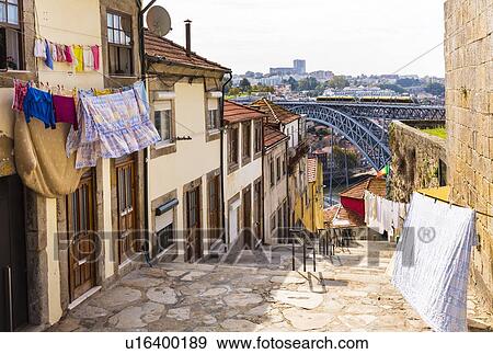 Stock Photo - Washing lines in front of building, Ponte Dom Lus I in background, Porto, Portugal. Fotosearch
