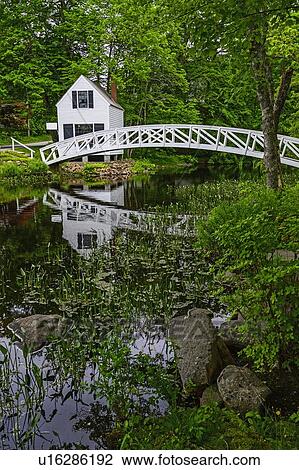 Stock Image - White building and bridge in Somesville, Mount Desert Island, USA. Fotosearch