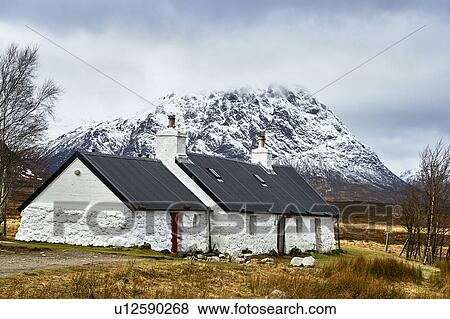 Stock Photo - White coloured cottages in countryside, Scottish Borders, United Kingdom. Fotosearch
