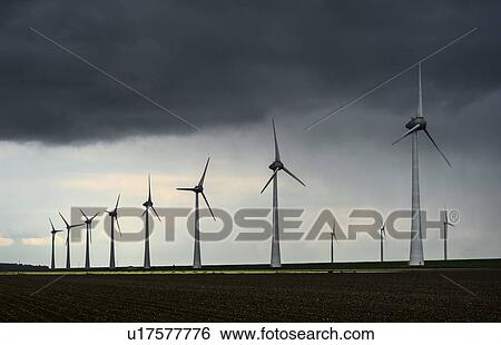 Stock Photograph - Windfarm on rainy day, Noordoostpolder, Urk, Flevoland, Netherlands. Fotosearch