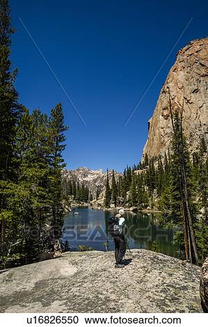 Woman by river in Sawtooth Mountains in Stanley, Idaho, USA View Large Photo Image Stock Image - Woman by river in Sawtooth Mountains in Stanley, Idaho, USA. Fotosearch