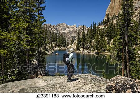 Woman by river in Sawtooth Mountains in Stanley, Idaho, USA View Large Photo Image Stock Image - Woman by river in Sawtooth Mountains in Stanley, Idaho, USA. Fotosearch