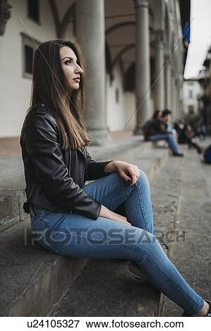 Stock Photo - Woman daydreaming on steps. Fotosearch