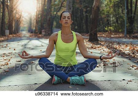 Picture - Woman doing yoga. Fotosearch