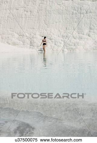 Stock Photography - Woman enjoying thermal pool, Pamukkale, Denizli, Turkey. Fotosearch