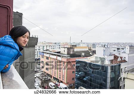 Woman enjoying view from rooftop, Greme, Cappadocia, Nevsehir, Turkey View Large Photo Image Stock Photograph - Woman enjoying view from rooftop, Greme, Cappadocia, Nevsehir, Turkey. Fotosearch