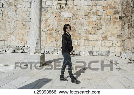 Woman exploring ancient city, Izmir, Turkey View Large Photo Image Stock Photograph - Woman exploring ancient city, Izmir, Turkey. Fotosearch