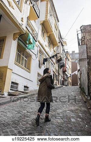 Stock Photography - Woman exploring city, Istanbul, Turkey. Fotosearch