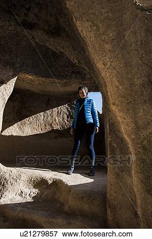 Stock Photo - Woman exploring Selime Monastery, Greme, Cappadocia, Nevsehir, Turkey. Fotosearch