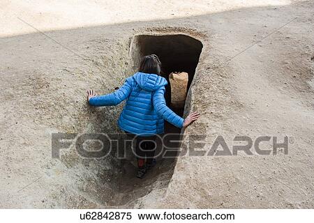 Stock Photography - Woman exploring Selime Monastery, Greme, Cappadocia, Nevsehir, Turkey. Fotosearch