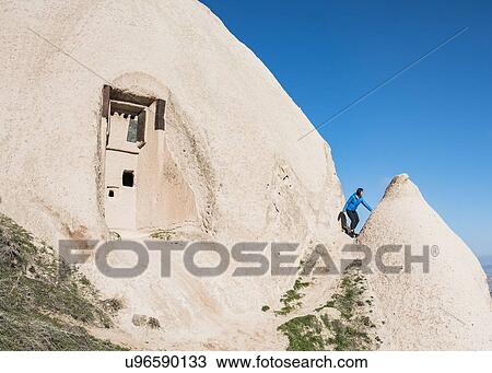 Woman exploring Uchisar Castle, Greme, Cappadocia, Nevsehir, Turkey View Large Photo Image Stock Image - Woman exploring Uchisar Castle, Greme, Cappadocia, Nevsehir, Turkey. Fotosearch