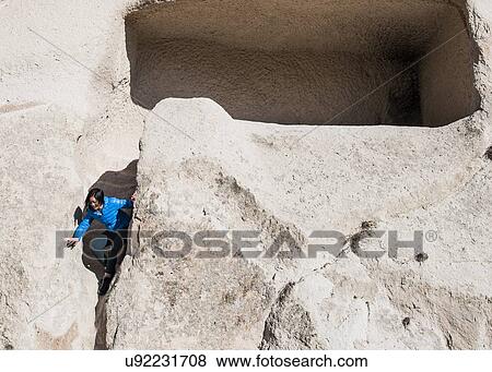 Stock Photo - Woman exploring Uchisar Castle, Greme, Cappadocia, Nevsehir, Turkey. Fotosearch