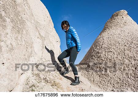 Woman exploring Uchisar Castle, Greme, Cappadocia, Nevsehir, Turkey View Large Photo Image Stock Photograph - Woman exploring Uchisar Castle, Greme, Cappadocia, Nevsehir, Turkey. Fotosearch