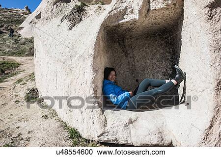 Woman lying down in cavern, Uchisar Castle, Greme, Cappadocia, Nevsehir, Turkey View Large Photo Image Stock Image - Woman lying down in cavern, Uchisar Castle, Greme, Cappadocia, Nevsehir, Turkey. Fotosearch