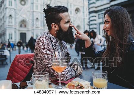 Woman playfully tapping nose of man in cafe, Santa Maria del Fiore, Firenze, Toscana, Italy View Large Photo Image Stock Image - Woman playfully tapping nose of man in cafe, Santa Maria del Fiore, Firenze, Toscana, Italy. Fotosearch