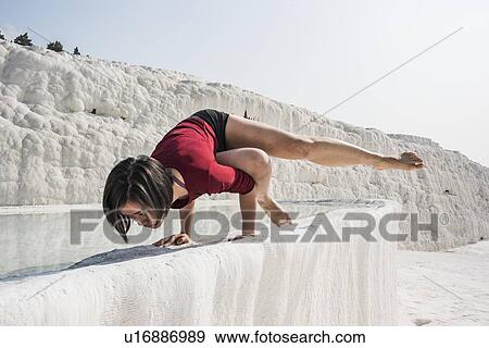 Woman practising yoga in cotton castle, Pamukkale, Denizli, Turkey View Large Photo Image Stock Photo - Woman practising yoga in cotton castle, Pamukkale, Denizli, Turkey. Fotosearch