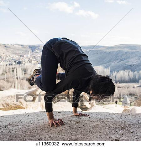 Woman practising yoga in Selime Monastery, Greme, Cappadocia, Nevsehir, Turkey View Large Photo Image Stock Image - Woman practising yoga in Selime Monastery, Greme, Cappadocia, Nevsehir, Turkey. Fotosearch