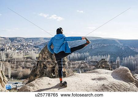 Woman practising yoga in Selime Monastery, Greme, Cappadocia, Nevsehir, Turkey View Large Photo Image Stock Photography - Woman practising yoga in Selime Monastery, Greme, Cappadocia, Nevsehir, Turkey. Fotosearch