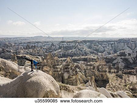 Woman practising yoga on top of rock, Greme, Cappadocia, Nevsehir, Turkey View Large Photo Image Stock Photography - Woman practising yoga on top of rock, Greme, Cappadocia, Nevsehir, Turkey. Fotosearch